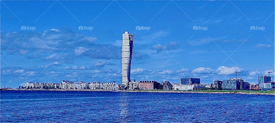 Abstract shapes can be further understood when they are given a name. Such is the case with the “Turning Torso” conference center in “Malmö”, “Sweden” by the “Baltic Sea”. Without actually turning the name is etched in. 2023. Hypnotic Productions