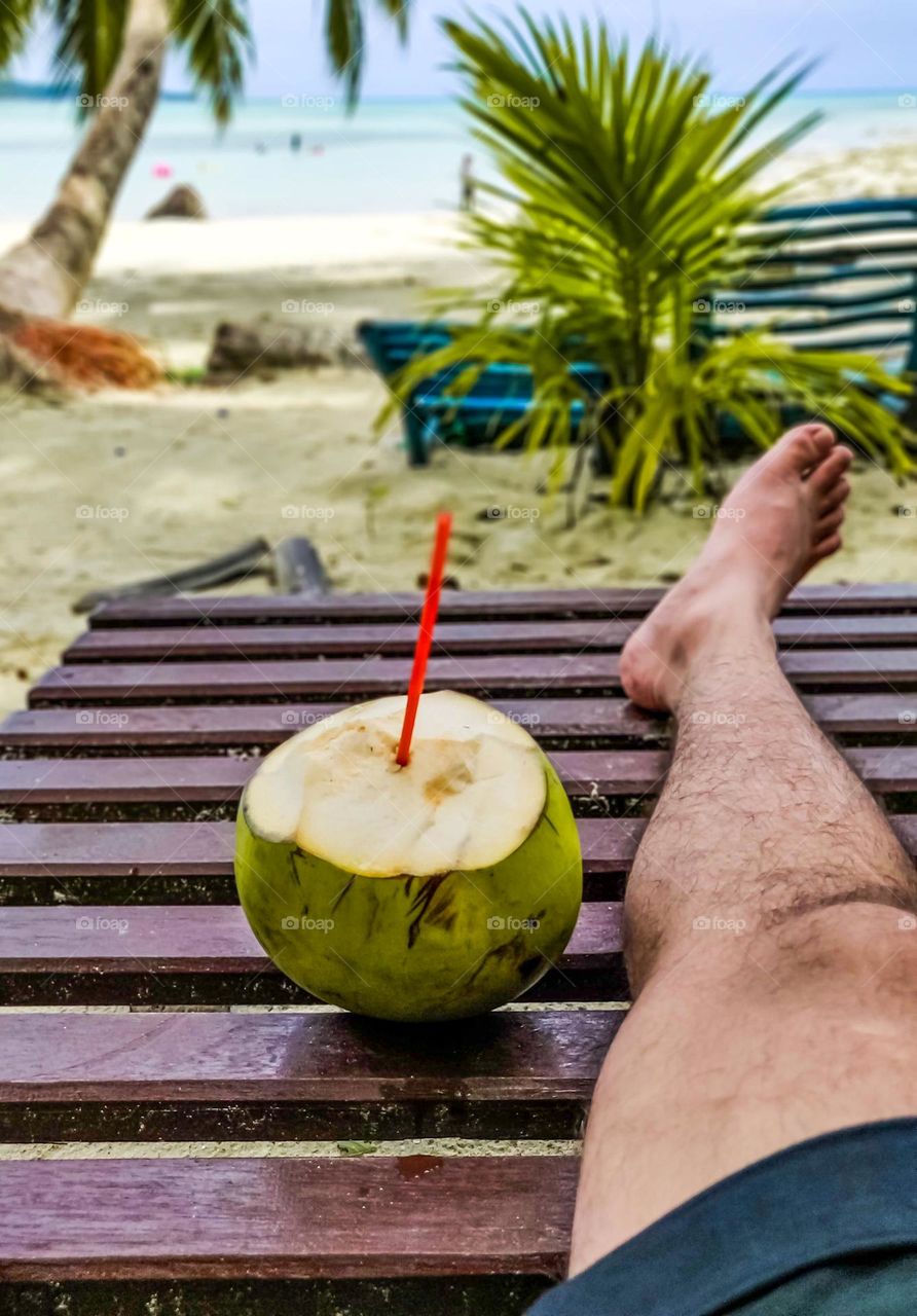 Summer vacation on an island with coconut water