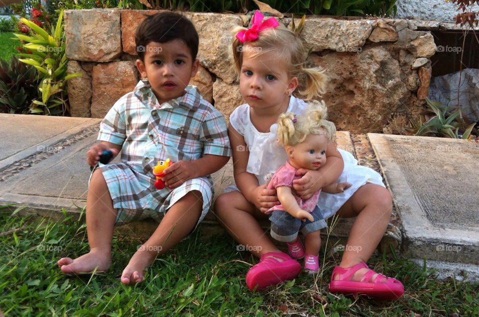 Boy and girl playing at a party