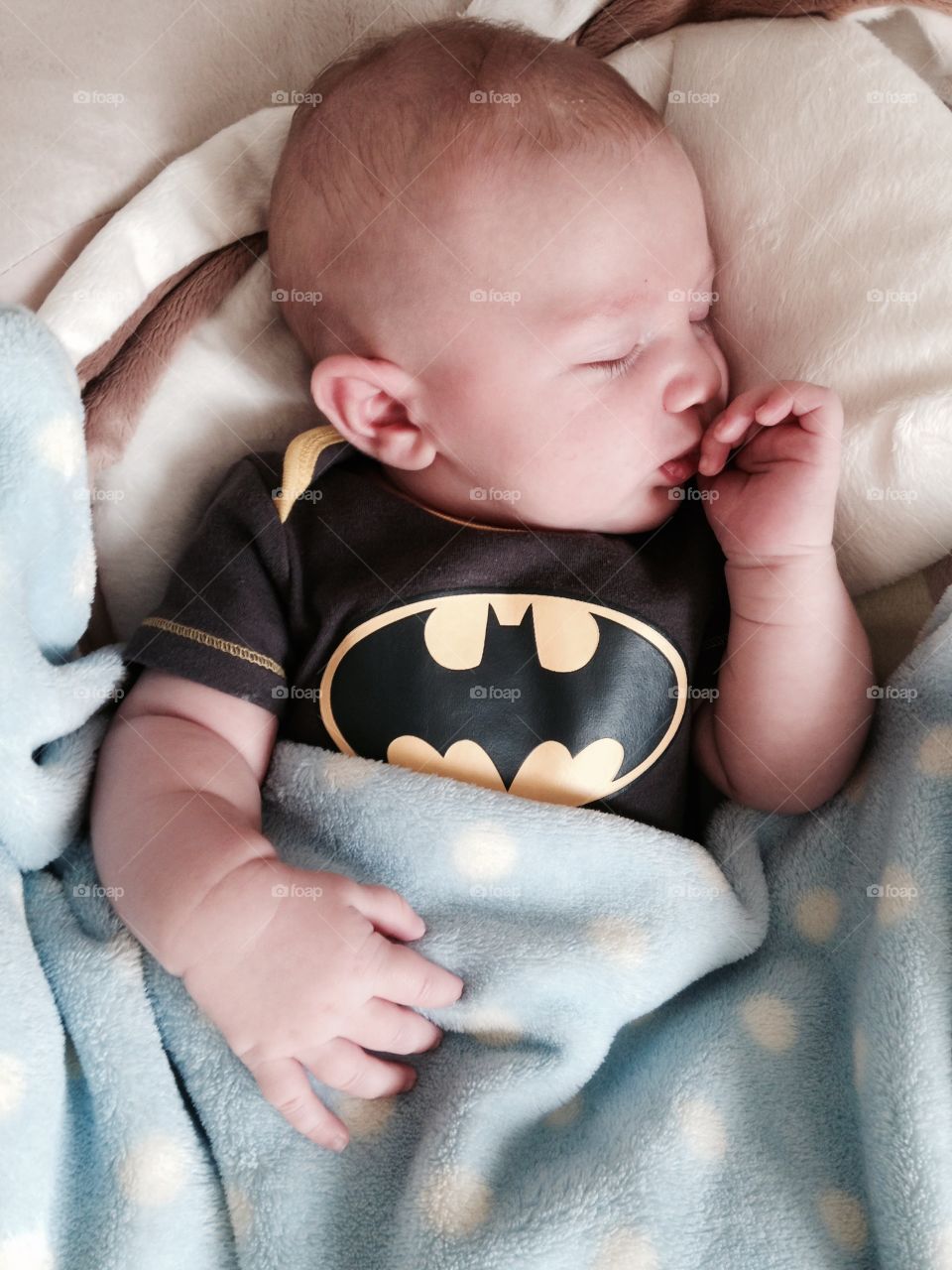 High angle view of baby boy sleeping on bed