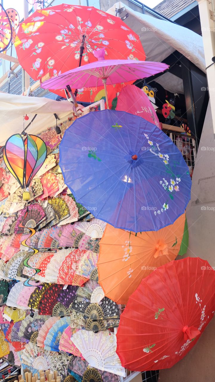 Market stall, Paper umbrellas, hand fan and wind mill