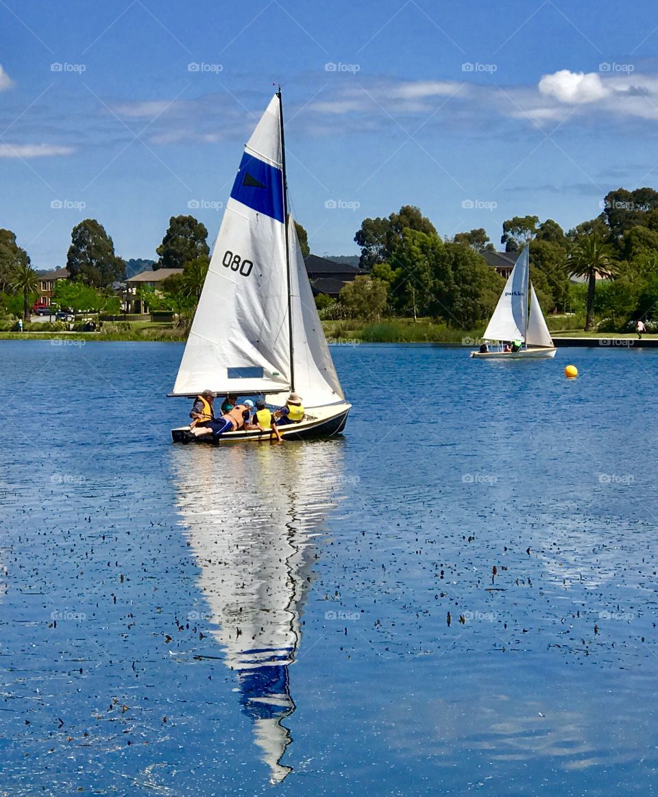 Sunny Sunday morning teaching the children how to sail on the lake. 