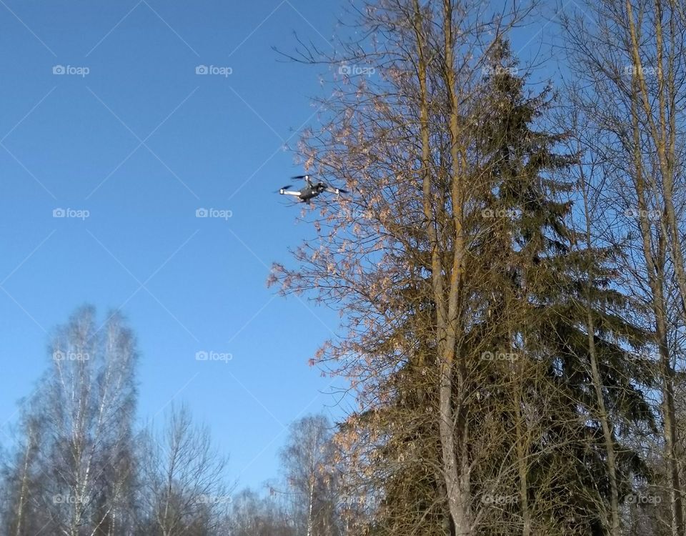 quadcopter landscape in the solar park blue sky background