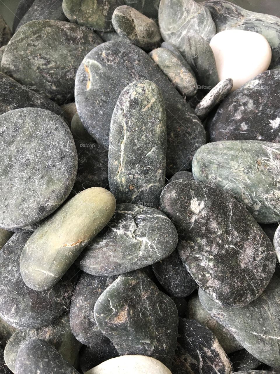 Rounded and smooth beach pebbles 