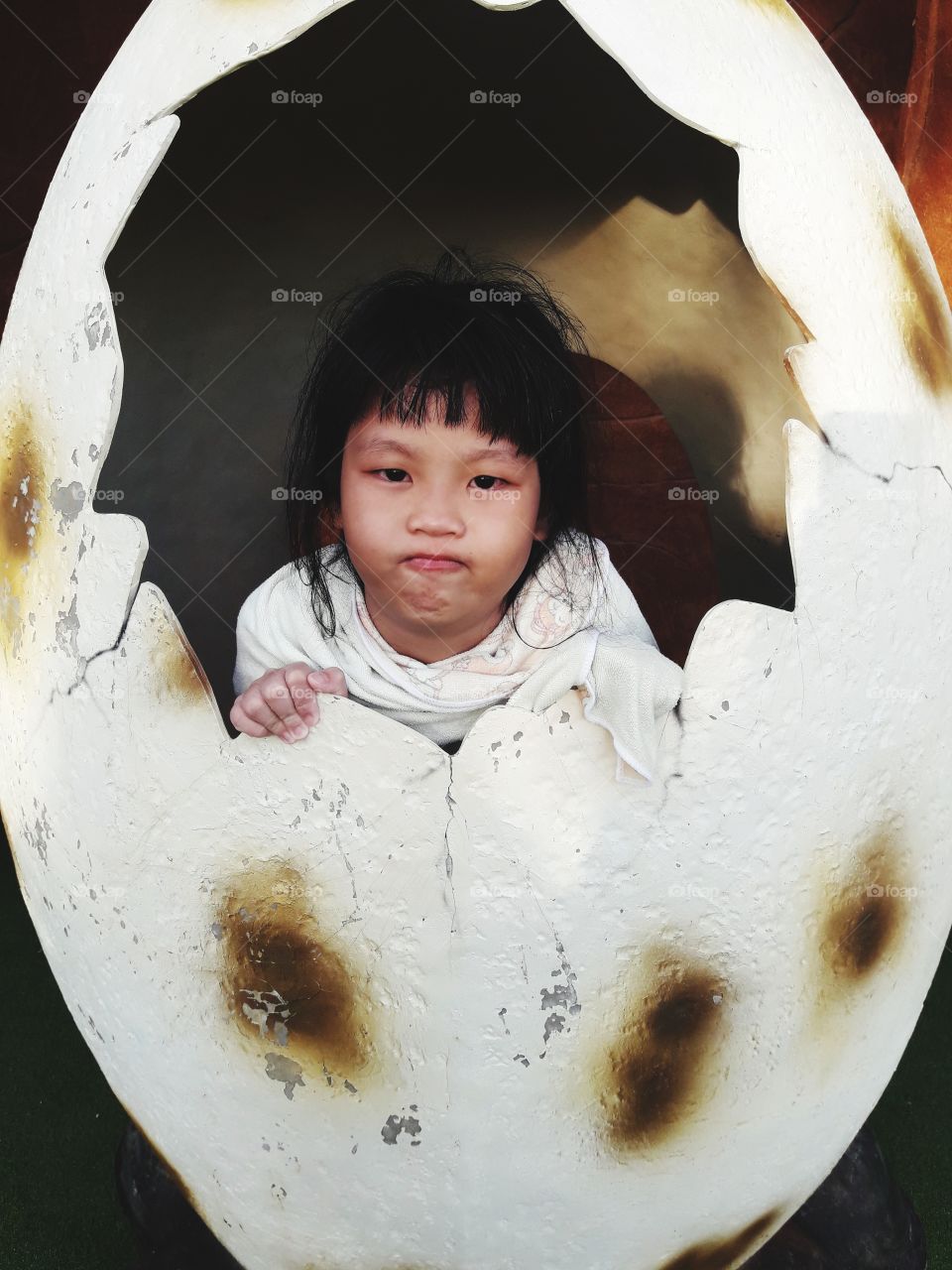a girl in dinosaur egg
