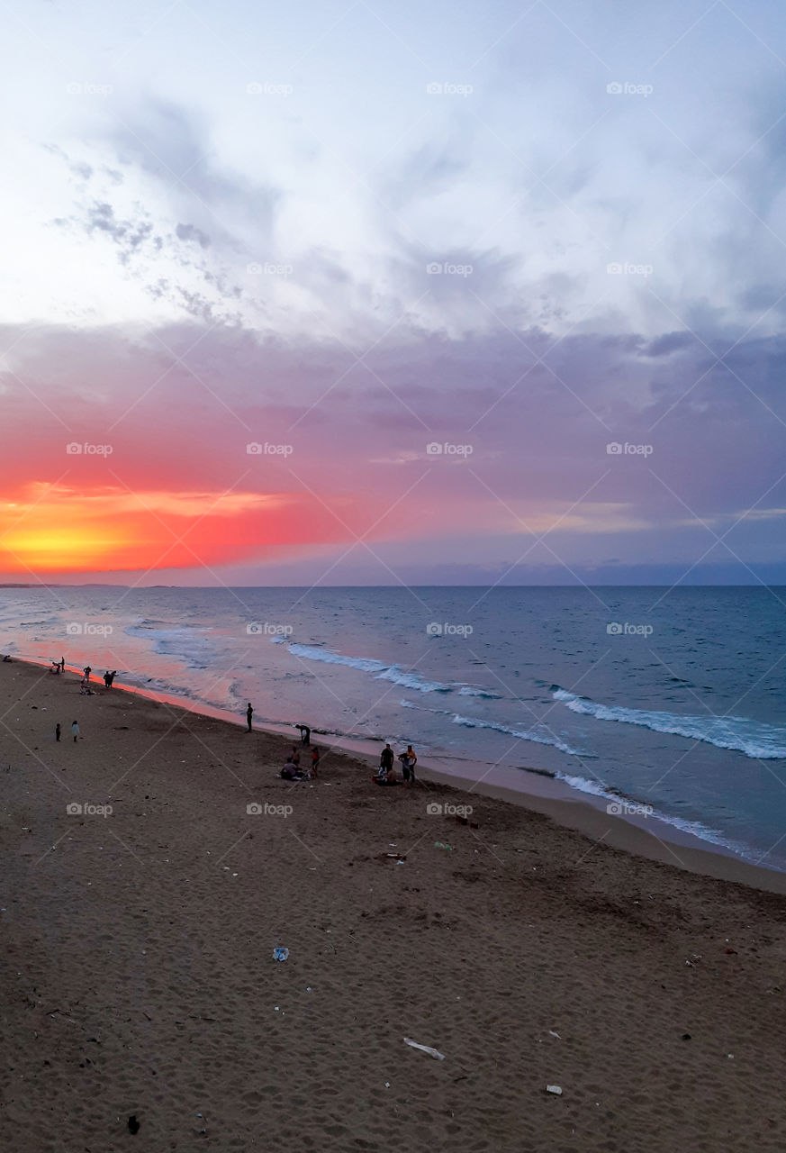 sunset over the beach and sea