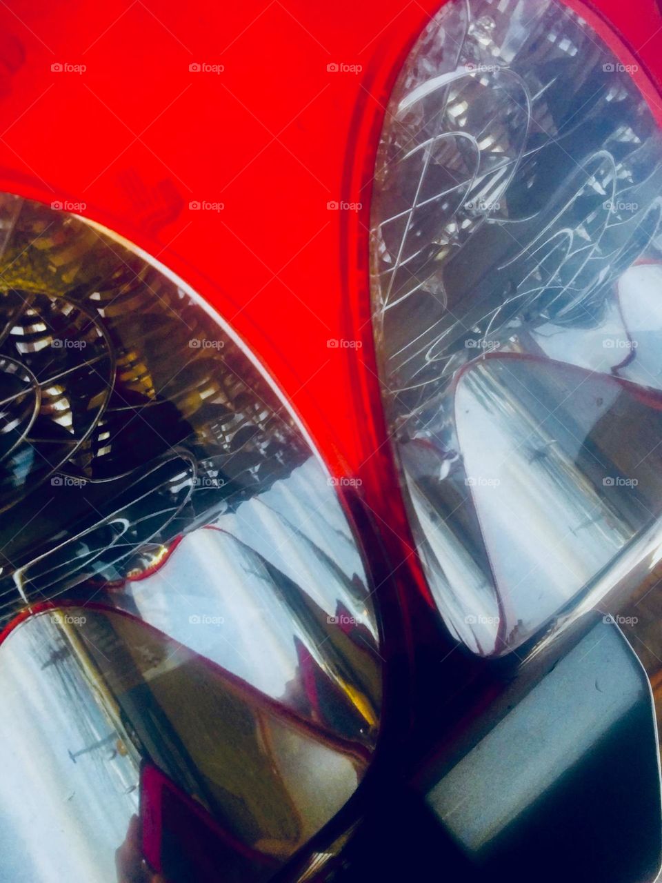 A fancy red sportscar parked in sunny LIC, Queens, NY got my attention as I walked by from the G train station towards the waterside. Photographed from unusual angles a realistic topic can take on a surrealistic look. 2020. Hypnotic Productions