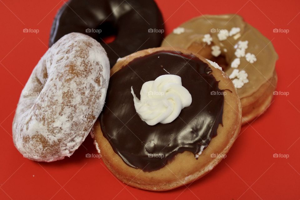 Delicious Donuts on Red Background 