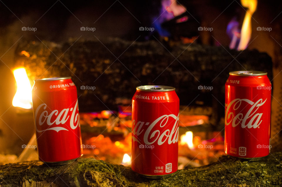 Enjoy a nice Coca-Cola in front of a warm fire