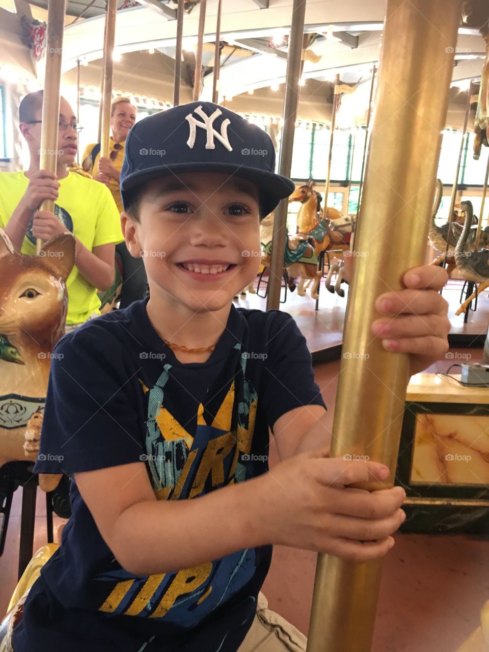 Boy on carousel 
