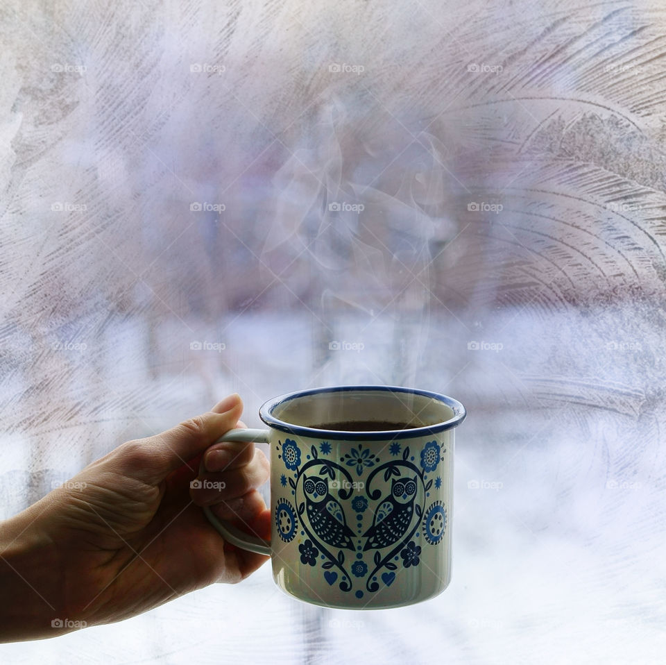 hot coffee and frosty window