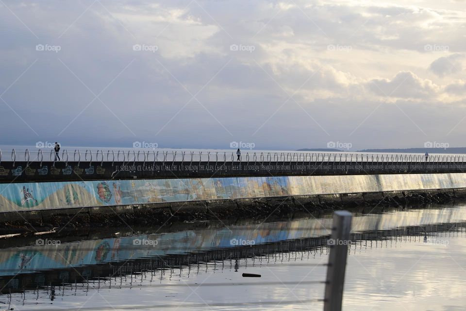 Breakwater shining on sunset 