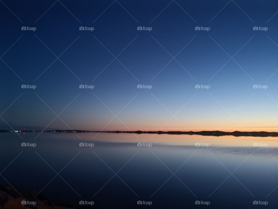 Magic twilight on the lagoon limited by the north dune. Îles-de-la-Madeleine, Québec, Canada.