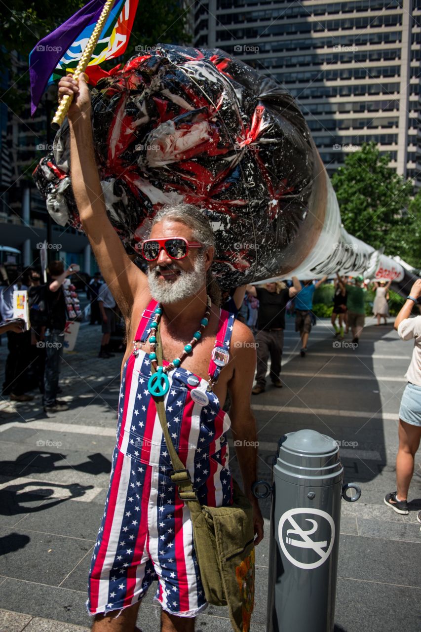Carrying a 51 foot long joint in protest of cannabis prohibition. 