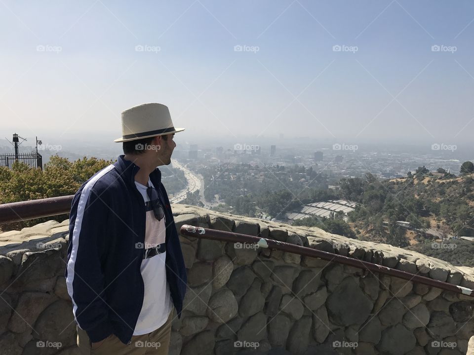 The full los Angeles experience overlooking the city skyline from Hollywood sign lookout point,; straw hat and everything😹😎 