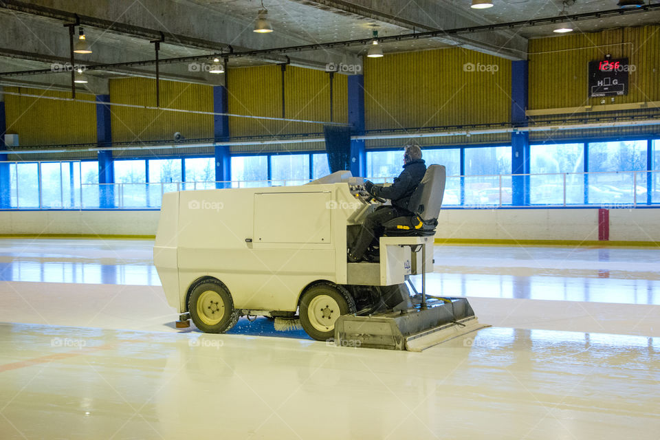 Ice resurfacing machine in work.
