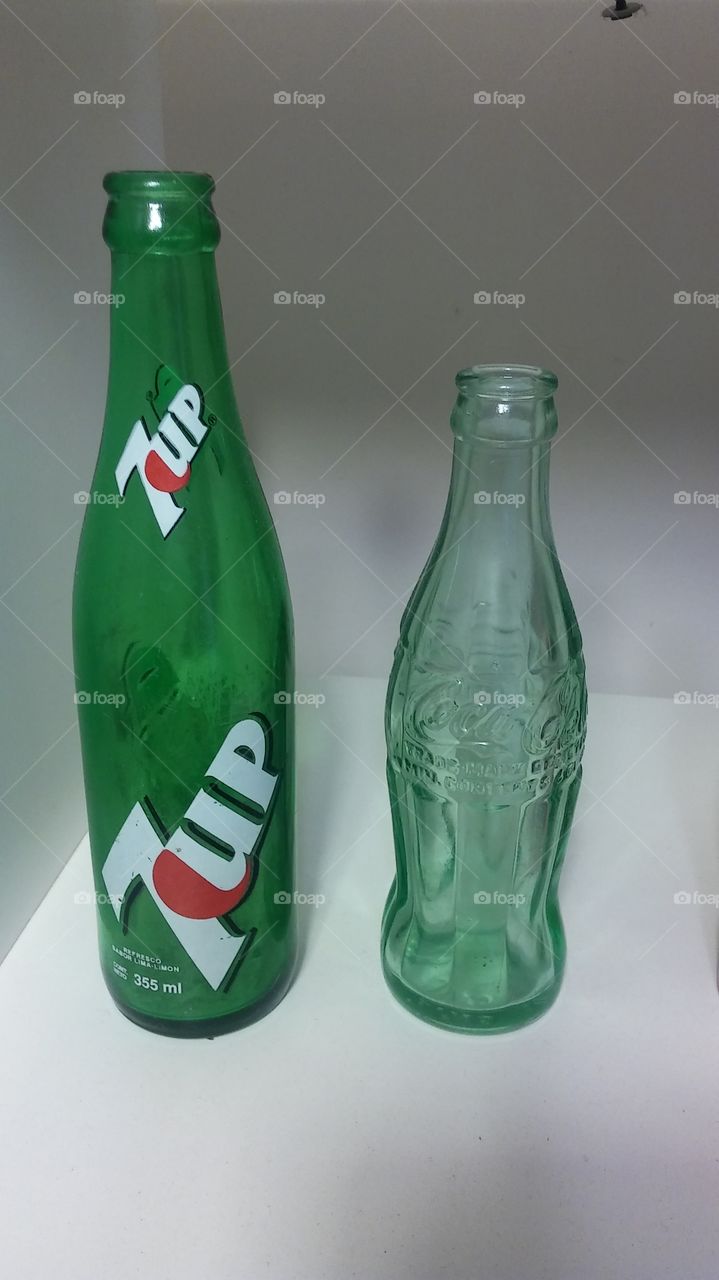 7up or Coca Cola. i found these 2 bottles...im not recycling them