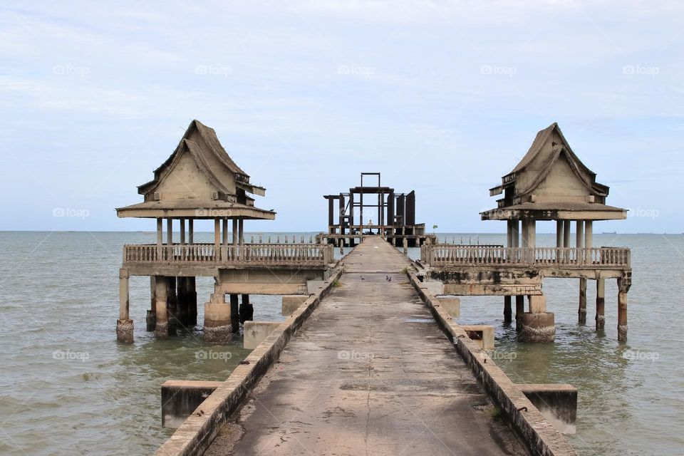 the Pier of an abandoned Buddhist Thai Temple by the Gulf of Thailand Southeast Asia