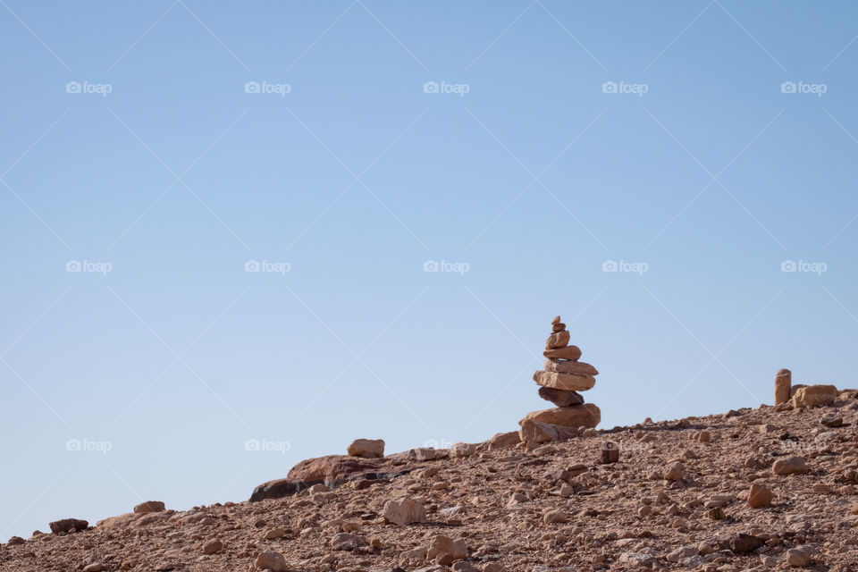 Stacking stone on blue sky background to show balance