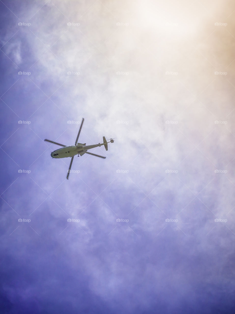 Helicopter flying with the blue sky