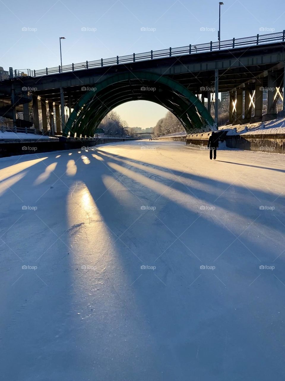 The Mackenzie Street Bridge as viewed at sunrise from the Rideau Canal Skateway.