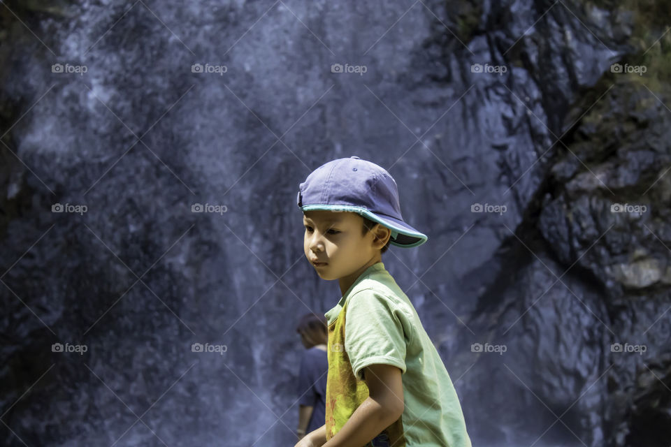 Portrait asean boy Background  Chok Kra-Dina WaterFalls at Kanchanaburi in Thailand