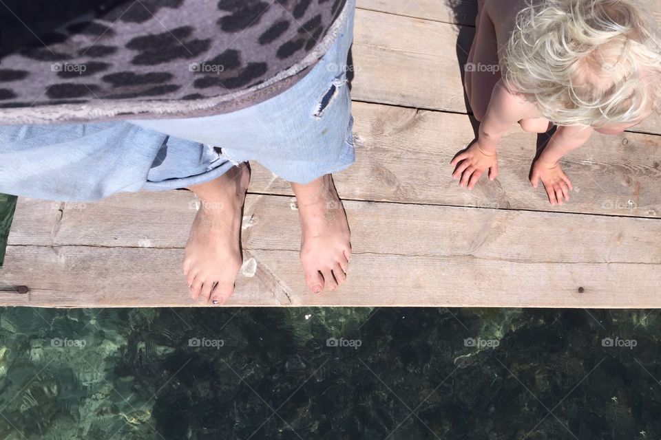 Mother and son on a jetty