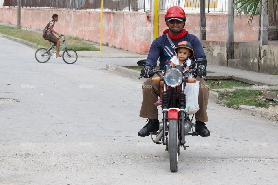 Cuba People.Motorcycle Child Passenger