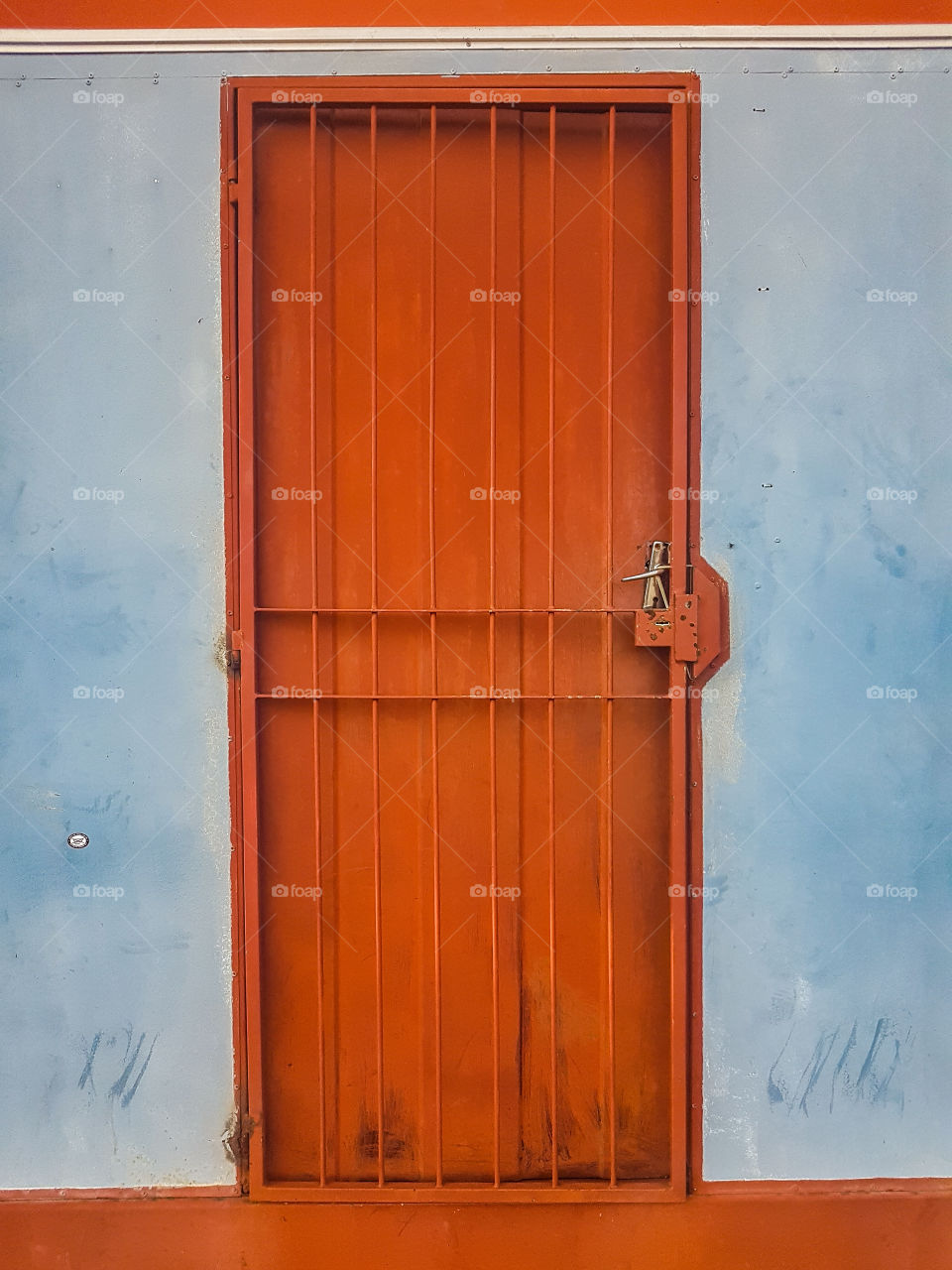 Rusted red secured door