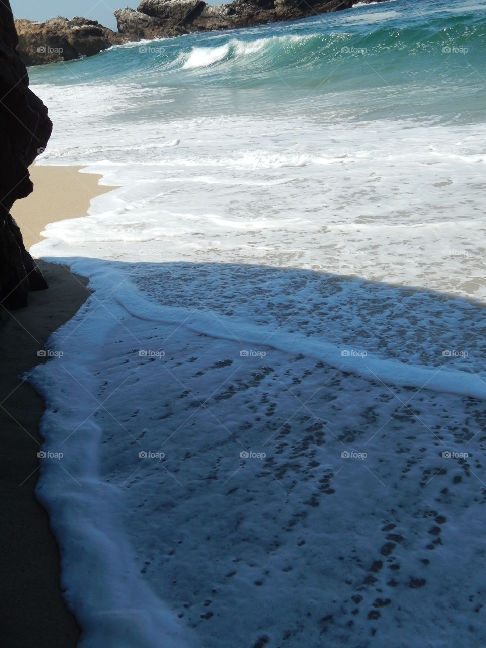 Big Sur beach with expansive sand and seafoam