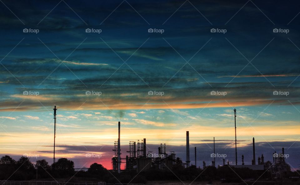 Another World. An oil refinery at sunset. A landscape scene that looks like it could be from another planet.