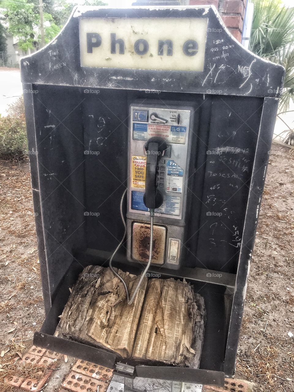 Bygone era old rusty phone booth 