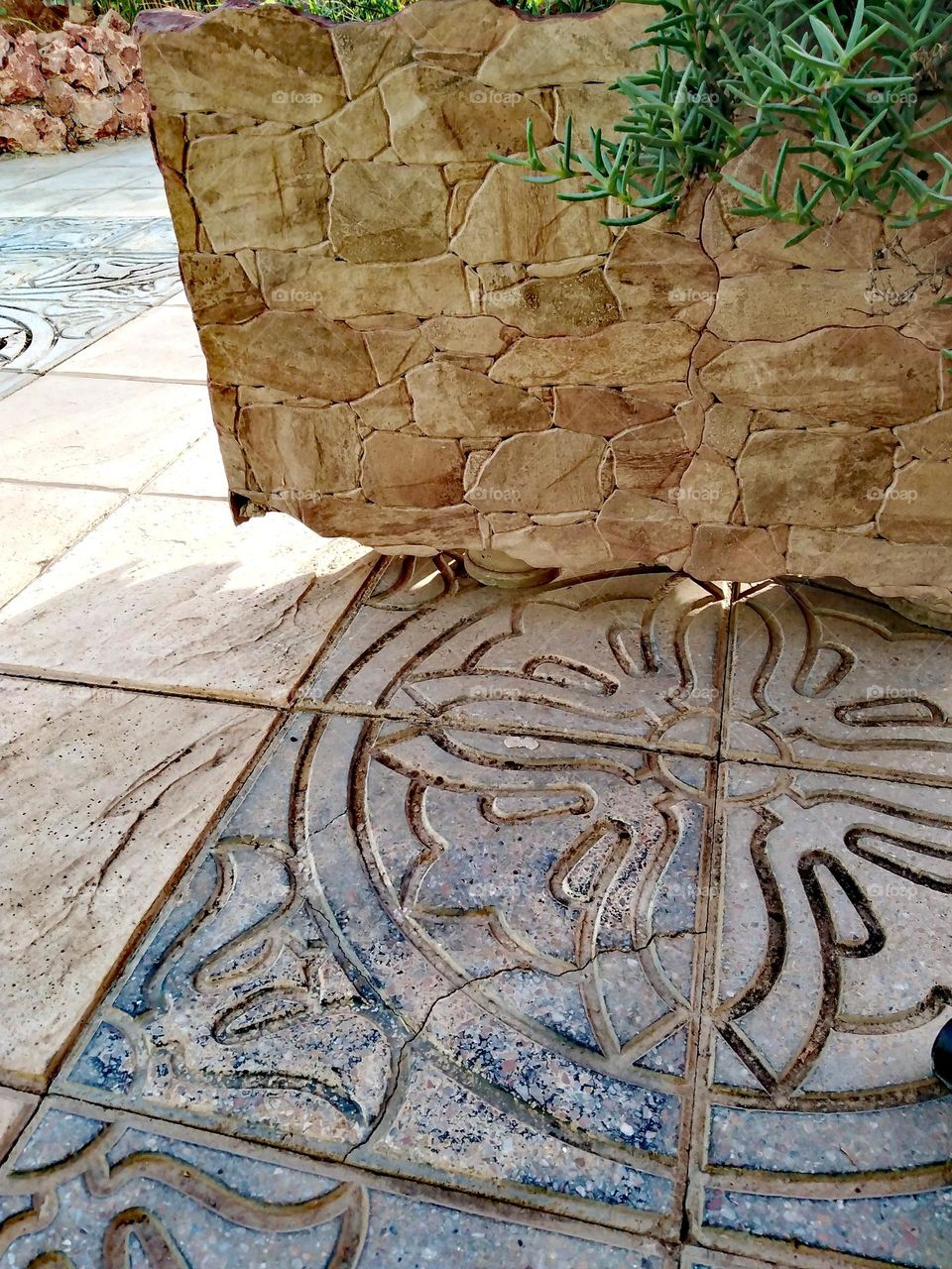 Shadow of a big Stone pot