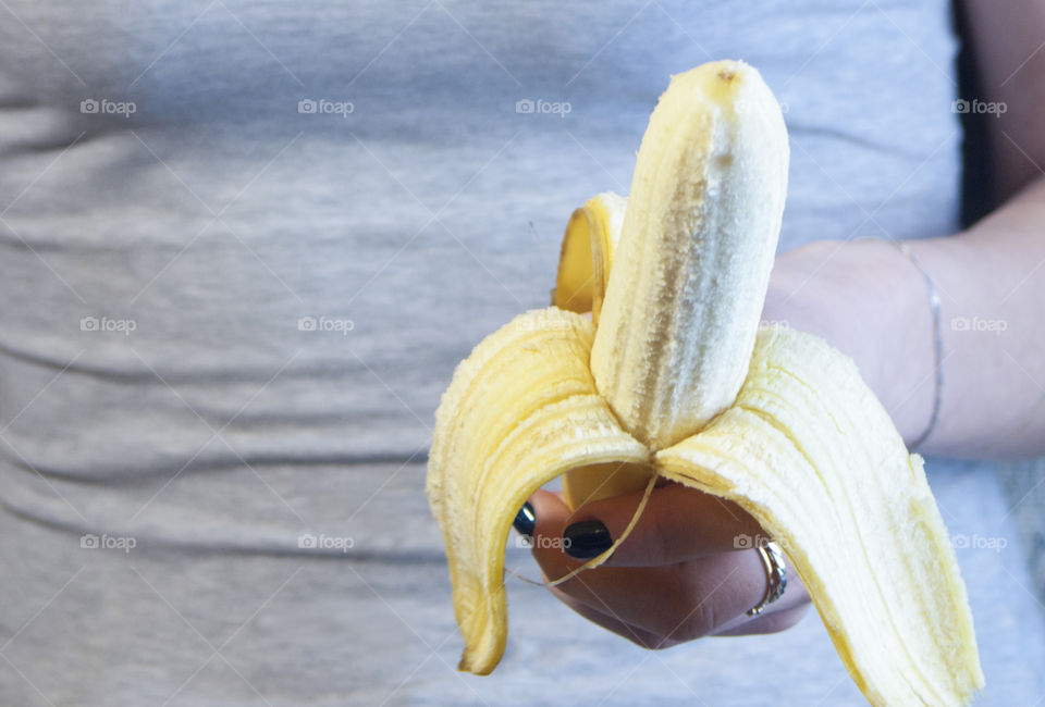 Banana in the hands of a girl