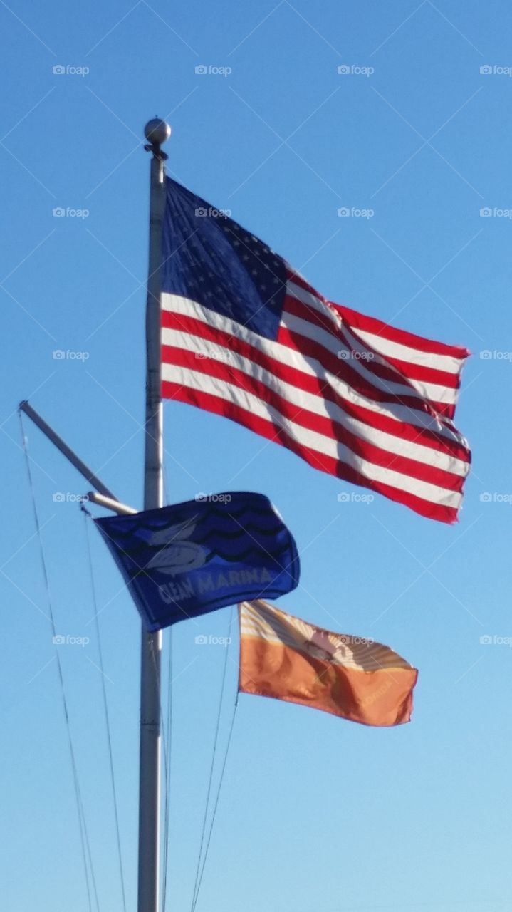 American flag above boat dock