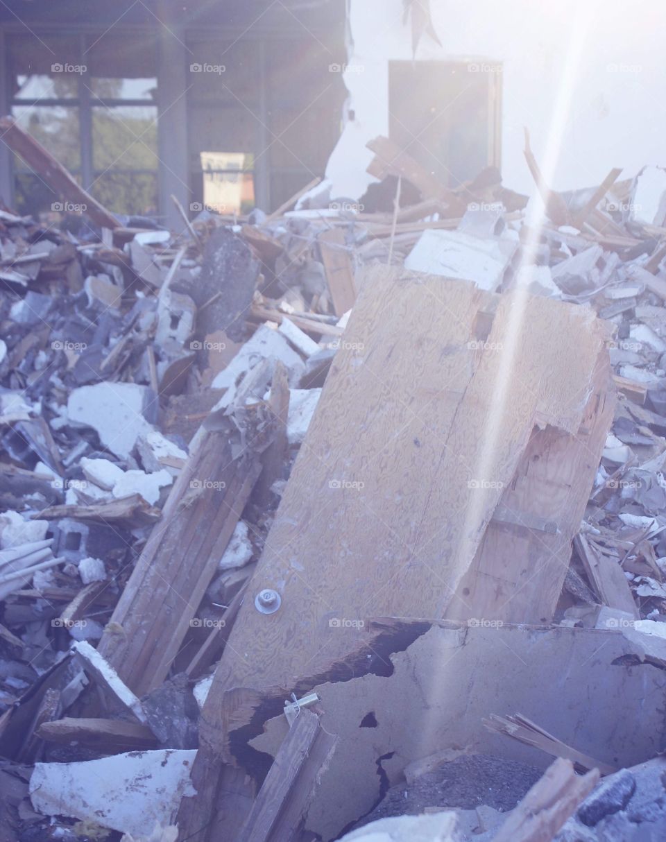 Broken door in the rubble of a demolished building