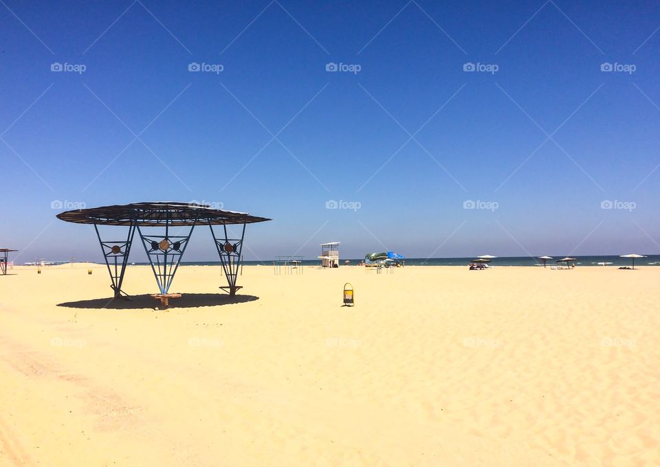 Almost empty beach at midday