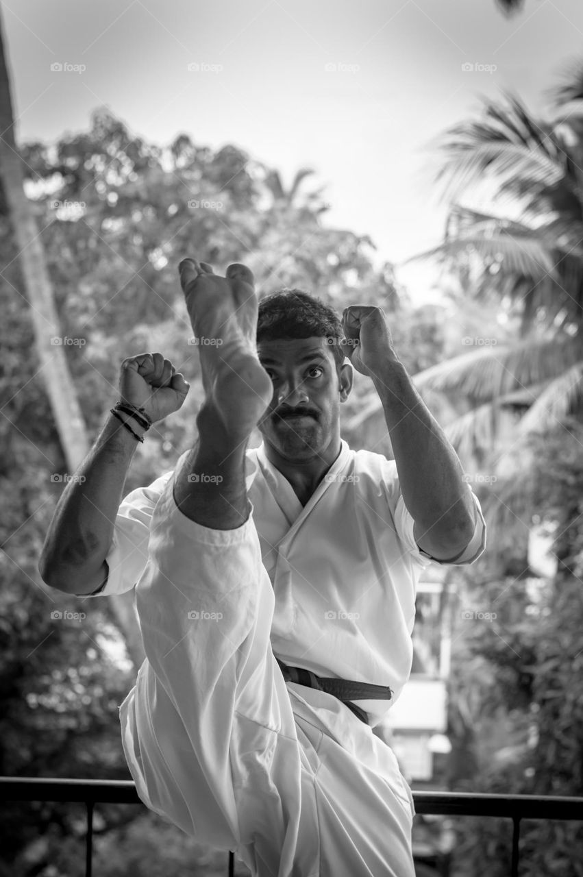 Young man practicing martial art.