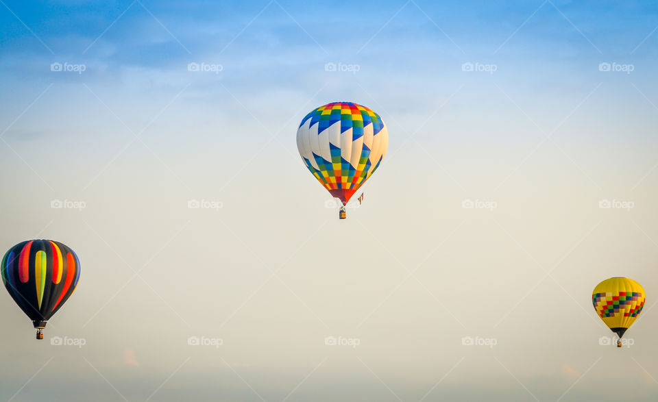 Looking up at hot air balloons. Looking up into the sky at three hot air balloon's at a festival in Waterford Wisconsin