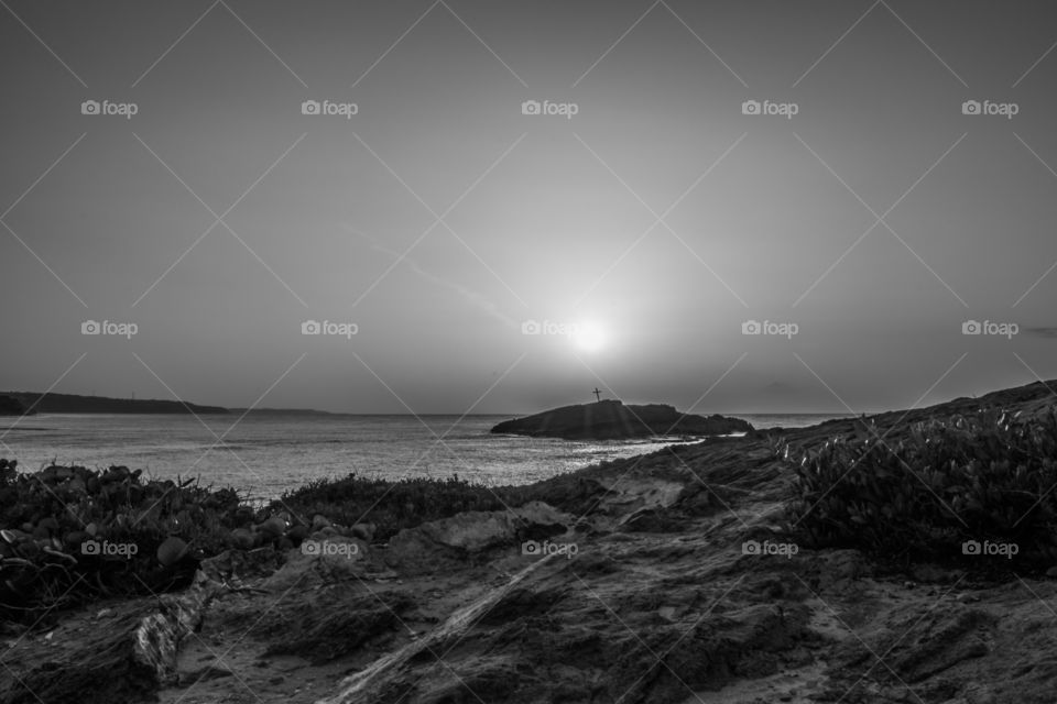 the sun shine over the cross