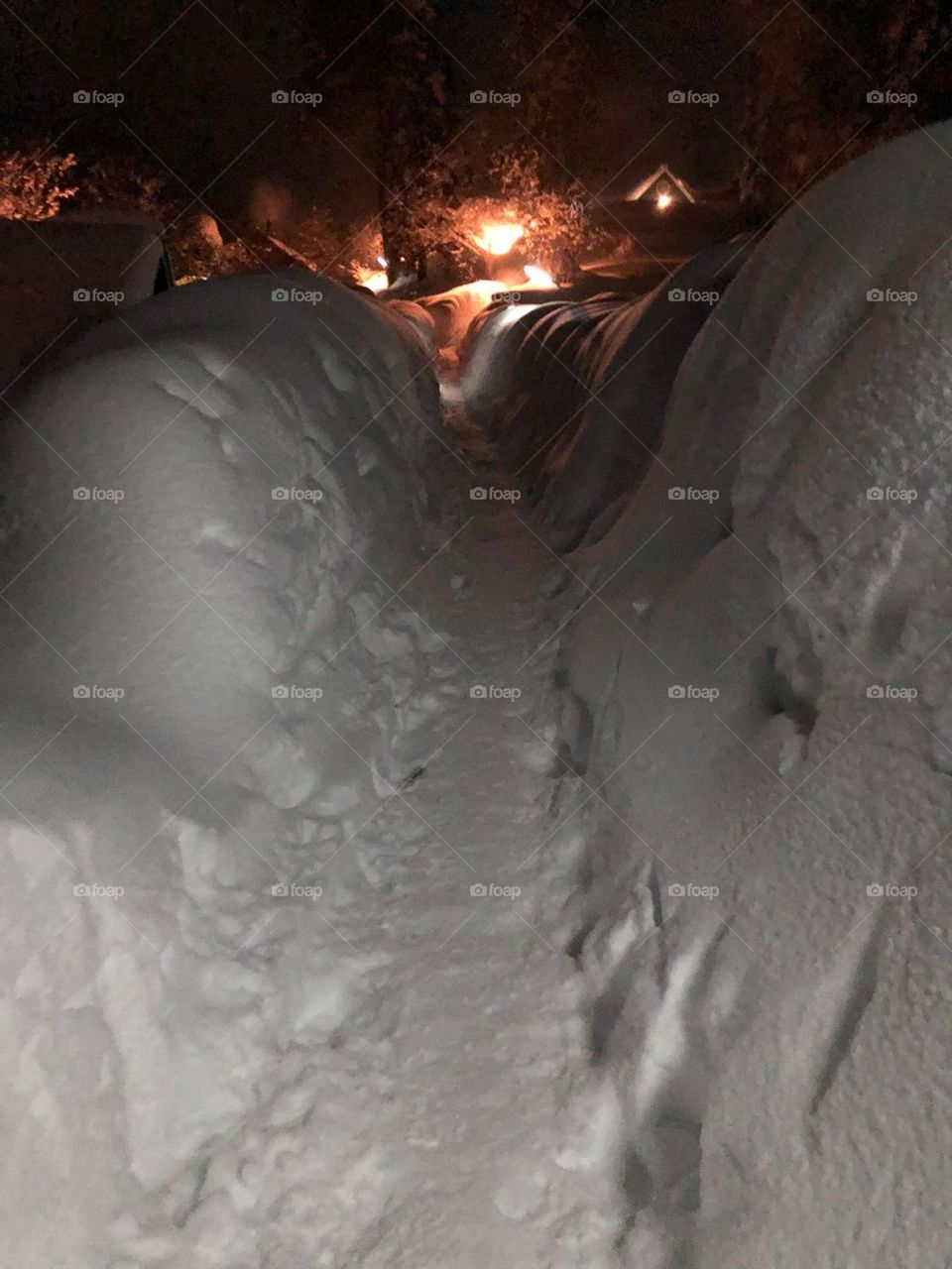 A path through the snow/ tunnel