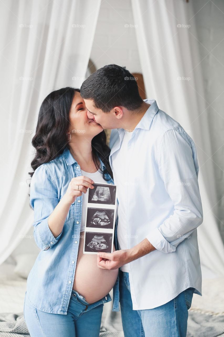 Happy family couple kissing