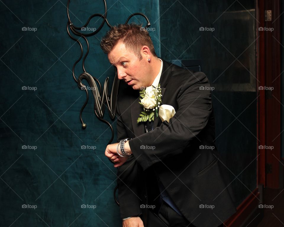 Elegant looking groom with wrist watch