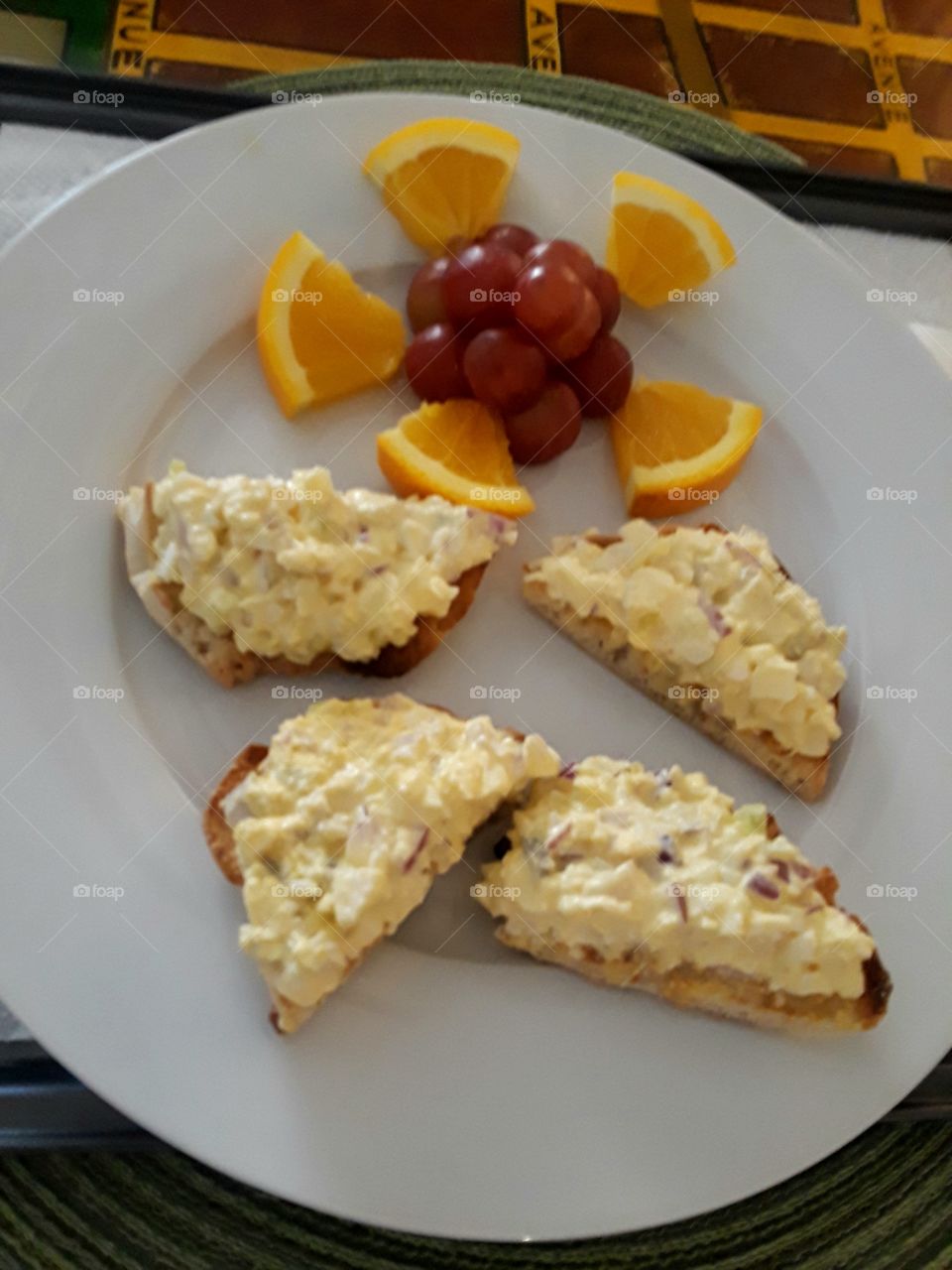 tasty egg salad in a toasted muffins