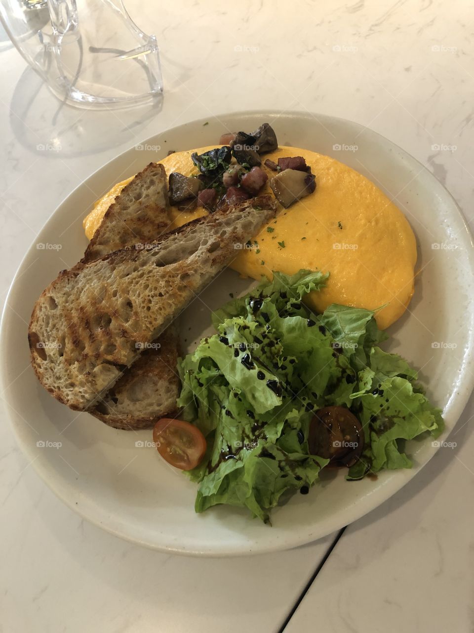 Sourdough toast with chicken spread and basil and grated egg