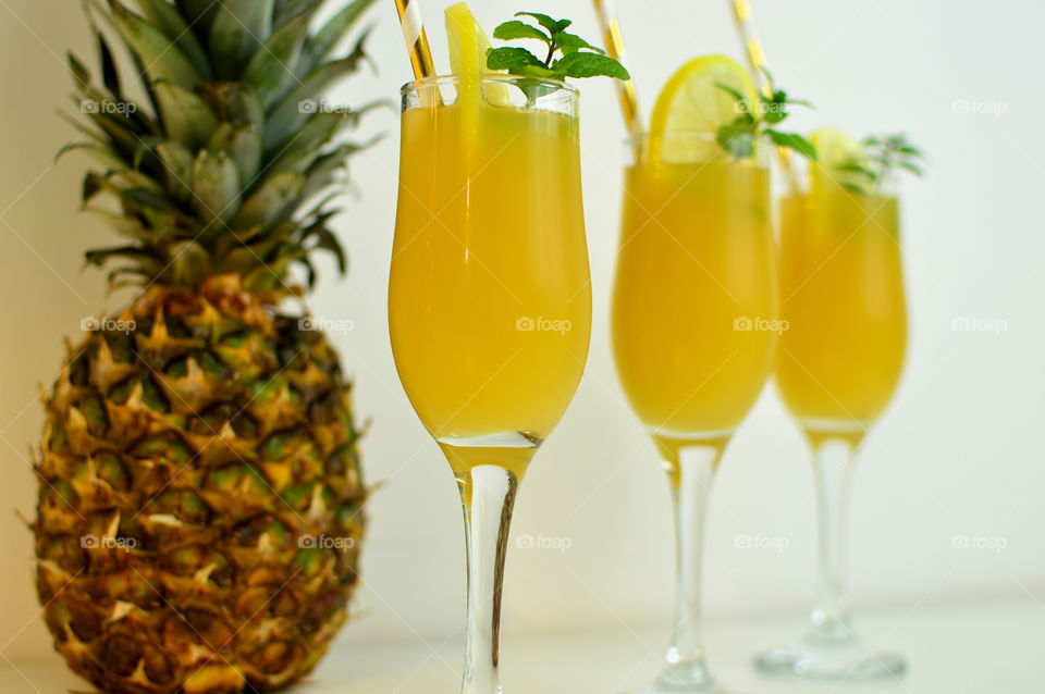 pineapple juice in three glasses