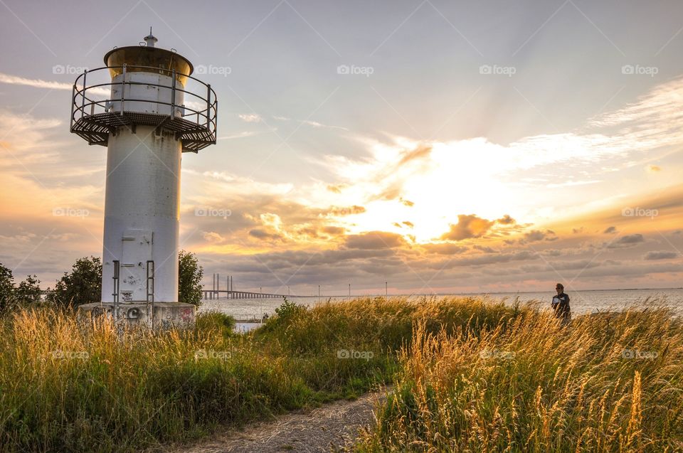 Lighthouse on grass field