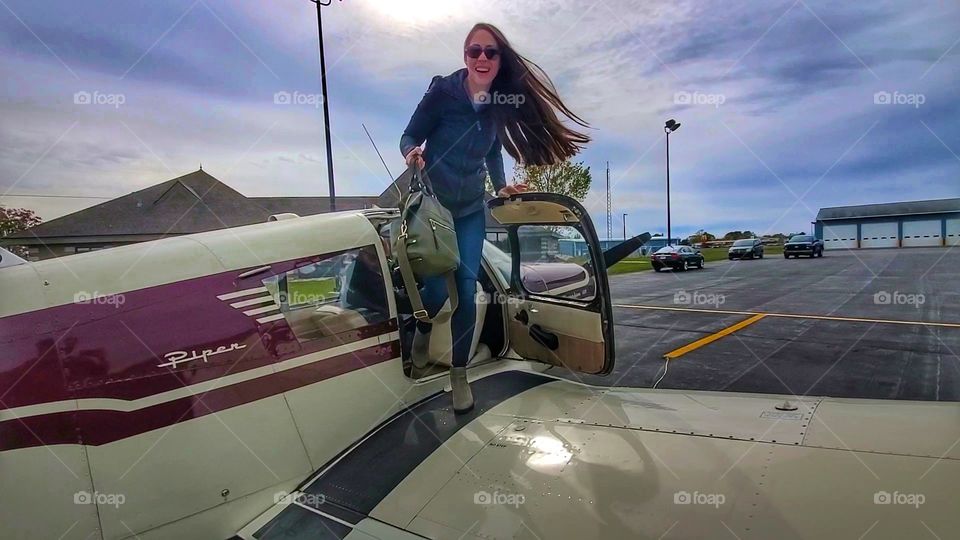 beautiful women disembarks plane