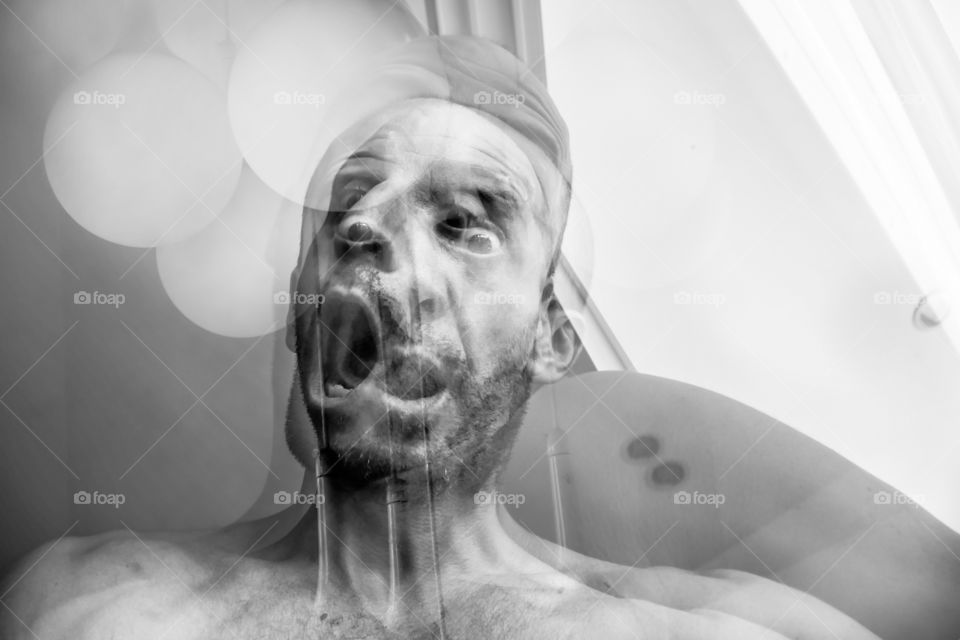 Man with suffocation and anguish of death, suffering of schizophrenia and mental disorder, mad man screaming, horrible nightmare