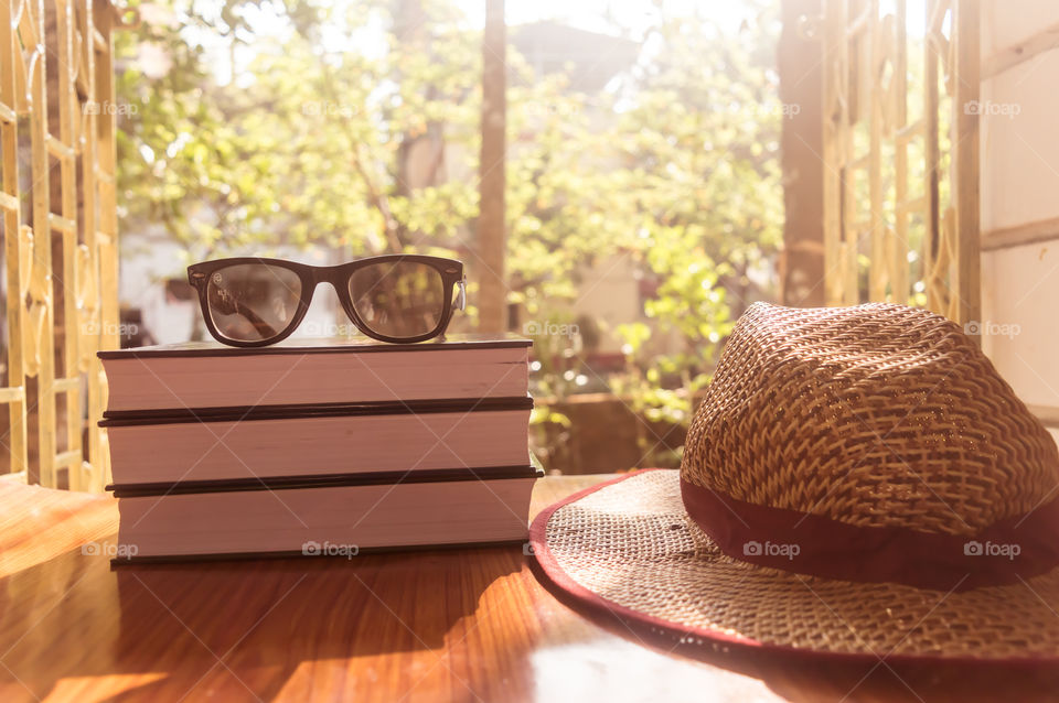 Front Side View Of Book and sunglasses with a straw hat. Summer holiday vacation background concept.


Front Side View Of Book and sunglasses with a straw hat. Summer holiday vacation background concept.